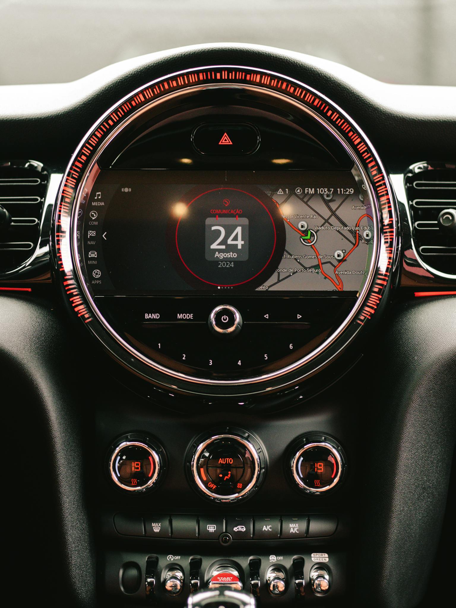 Close-up of a car dashboard with GPS navigation system and climate control settings.